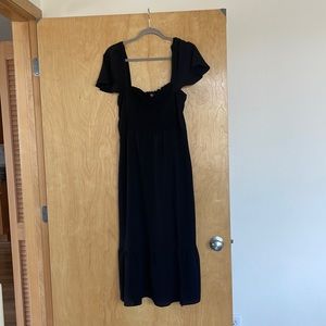 NTW Woman’s black off the shoulder dress